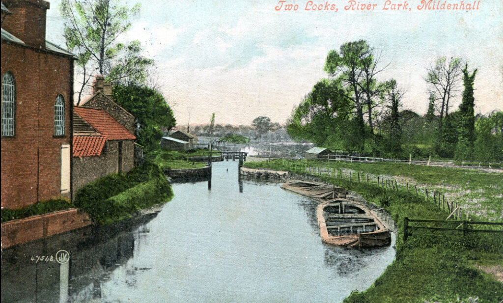 looking downriver with mill and barge