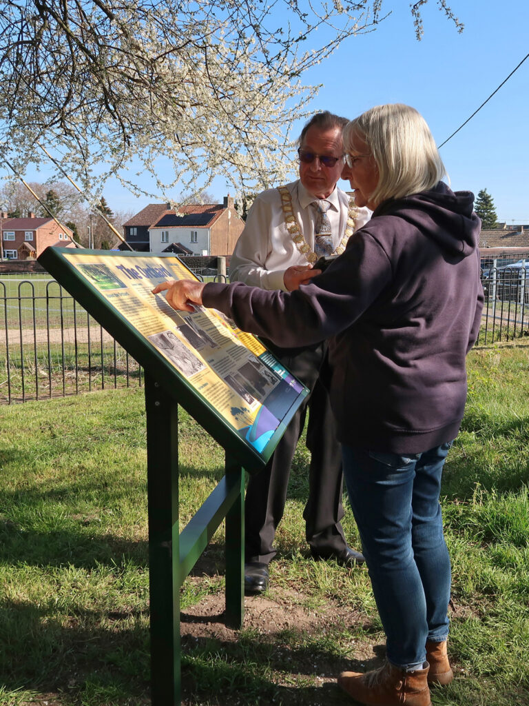 Councillor Phil Wittam and Martina Moss looking at the Orchard panel