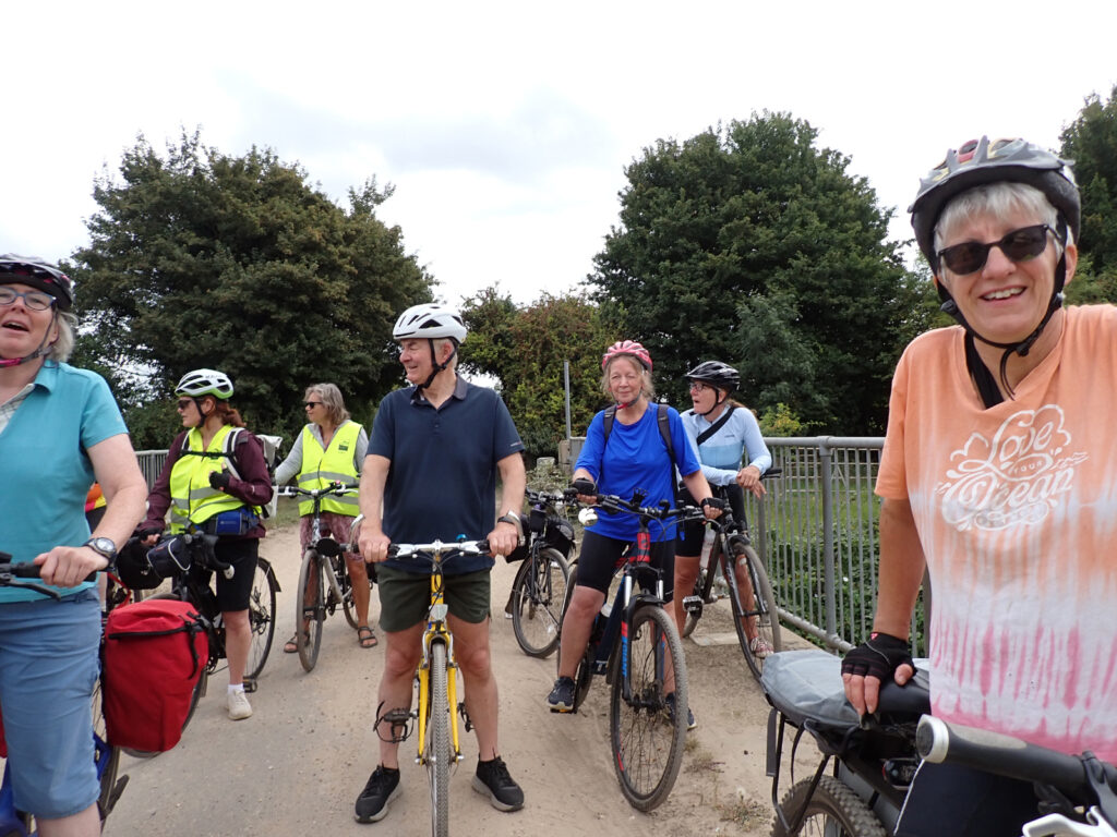 cyclists on a bridge over the Cut Off Channel