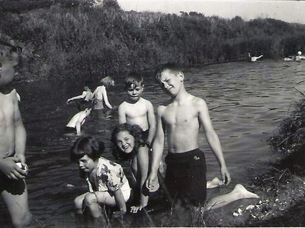 Boys and girls in a river, 1950s