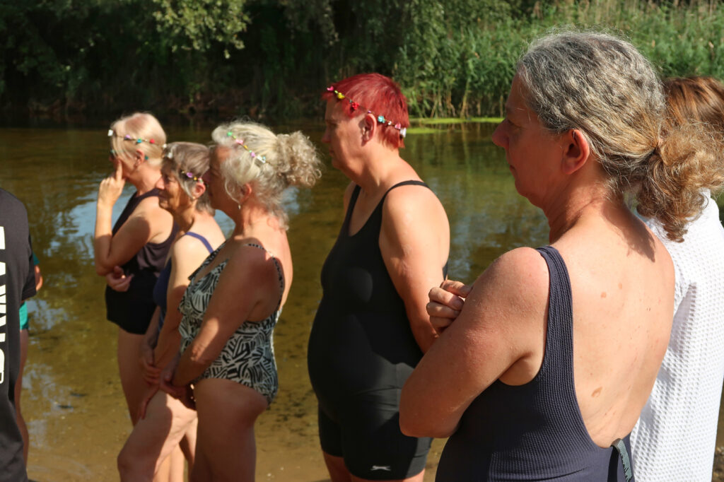 swimmers listening to interactive safety briefing at intro session Brandon Staunch 9 August